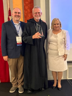 From Left to Right: Jeremy Helmes (FDLC Board), Abbot Douglas Mullin, and Rita Thiron (FDLC Executive Director)